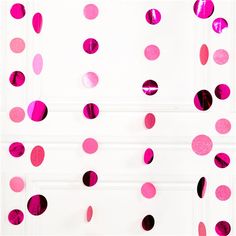 pink and black confetti hanging from the ceiling