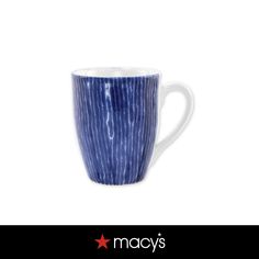 a blue and white coffee cup with the words macy's written on it in red