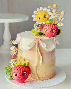 there is a cake decorated with strawberries and flowers