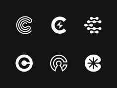 four different types of symbols on a black background