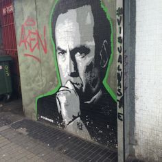 a painting of a man on the side of a building