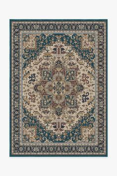 a blue and beige rug with an ornate design on the center, in front of a white background