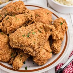 a plate full of fried chicken on a table