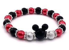 Oh how I love this bracelet!  Adorable mouse stretch bracelet adorned with silver sparkly beads!  Stretch material makes for easy on and easy off fit!  Lightweight yet sturdy!  This makes such a great gift for that mouse lover in your life!  I take great care and pride in each piece that I create and I hand make each piece myself  Makes a great gift for someone or keep as a gift for yourself!  I also offer this in the mouse beads that are red and white!  Check my Etsy shop for those colors!  You could get all three and stack them!!  And as always, FREE domestic SHIPPING and FREE GIFT WRAP Inspired Bracelets, Diy Jewelry Making Tutorials, Black Mouse, Making Bracelets With Beads, Dangle Bracelet, Making Bracelets, Jewelry Making Tutorials, Beaded Dangle Earrings, Valentines Day Hearts