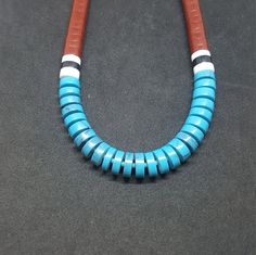 Heishi shell Multi Stone: Turquoise,Red Sandstone, Black Onyx, White Buffalo Turquoise sterling silver necklace Handmade in USA Blue Necklace With Round Inlay, Artisan Blue Inlay Necklaces, Southwestern Blue Turquoise Inlay Necklace, Southwestern Blue Necklace With Inlay, Southwestern Blue Inlay Necklace, Southwestern Style Blue Inlay Necklace, Red Sandstone, White Buffalo Turquoise, White Buffalo