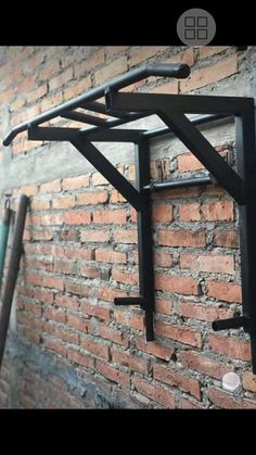 a brick wall with metal brackets on it