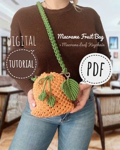 a woman holding a crocheted pumpkin purse