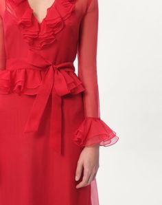 Organza Midi Dress - Ruffle detail - Waist belt - Back zip closure - Organza (100% Silk ) - Habotai slip ( 100% Silk) - Length: 120 cm / 47.2 in. from the shoulders in an Italian size 40 - Sleeve length: 70 cm / 27.5 in. from the centre back in an Italian size 40 - The model is 176 cm / 5'9" tall and wears an Italian size 40 - Made in Italy The look of the model is completed by a Valentino Garavani Vain Bag and Valentino Garavani Bowow Shoes. Belted Fitted Dress For Gala, Fitted Belted Dress For Gala, Elegant Red Belted Dress, Spring Evening Belted Dress, Silk Fitted Midi Dress With Belt, Spring Evening Midi Dress With Belt, Formal Red Belted Midi Dress, Knee-length Party Dresses With Belt, Red Belted Midi Dress For Formal Occasions