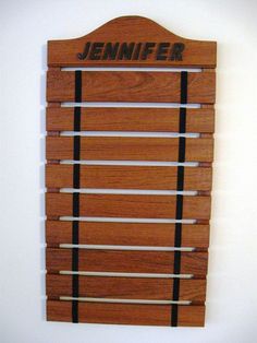 a wooden wall hanging with the name jennyfer on it