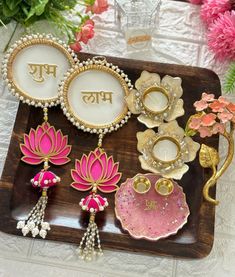 decorative items displayed on wooden tray with flowers