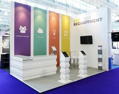 a trade show booth with colorful displays on the wall