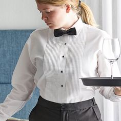 Highlight the sophistication of your establishment with this Henry Segal women's white tuxedo shirt with lay-down collar. Made from a high-quality 65/35 polyester-cotton broadcloth, this shirt does not sacrifice strength for comfort; it is both soft to the touch, providing comfort and breathability throughout shifts, and tightly-woven, capable of enduring the demands of daily commercial use. The blended material also resists wrinkling and shrinking and is machine washable, making it easy for you Luxury Formal Shirt With Ruffled Collar, Luxury Formal Shirt With Spread Collar, Vintage Tuxedo, Restaurant Uniforms, Reception Look, Tuxedo Shirt, White Tuxedo, Women Ties, Tuxedo Shirts