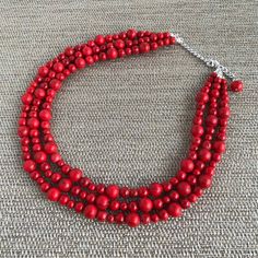 This gorgeous Red Turquoise Chunky Necklace goes with everything and everywhere, holiday party or after work with friends! The Necklace made from Red Turquoise beads, 16" short layer and 18" long layer with 3 inch extender chain for adjustment, and has light weight. Necklace would be a PERFECT GIFT for you or for your family and friends! Red Wooden Beads Jewelry As A Gift, Bohemian Red Jewelry For Christmas, Red Bohemian Jewelry For Christmas, Handmade Red Beaded Necklace For Holidays, Red Wooden Beads Jewelry For Gift, Red Coral Beaded Necklace With Wooden Beads, Handmade Red Necklace For Christmas, Handmade Red Beads For Christmas, Red Wooden Beaded Necklaces As Gifts