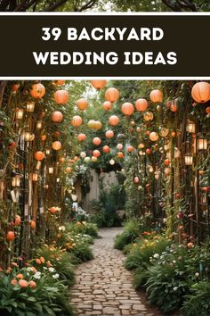 an outdoor garden with lots of lanterns hanging from the trees and flowers on the walkway