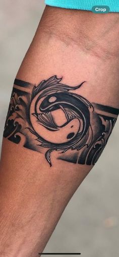 a man's arm with a tattoo on it and an image of a snake