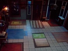 an overhead view of a room with tile flooring and rugs on the floor