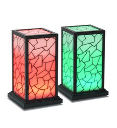 two colorful lamps sitting next to each other