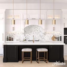 a kitchen with white cabinets and black counter tops, two stools in front of the sink