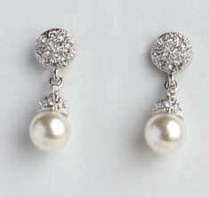 "These earrings are made with pearls and CZ diamonds. White gold plated. Tarnish resistant.  Each earring measures 2.5 cm (1 \") long.  The earrings will come in a gift box.   For more bridal earrings, please visit : http://www.etsy.com/shop/WearableArtz?section_id=6869826" Pearl Embellished Cubic Zirconia Earrings As Gift, Sparkling Pearl Earrings For Gift, Elegant Sparkling Drop Pearl Earrings, Elegant Sparkling Pearl Drop Earrings, Elegant Crystal Pearl Earrings For Pierced Ears, Classic Pearl Drop Crystal Earrings For Formal Occasions, Elegant Crystal Pearl Earrings, Classic Formal Crystal Earrings With Pearl Drop, Elegant Round Crystal Pearl Earrings