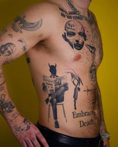 a man with many tattoos on his chest