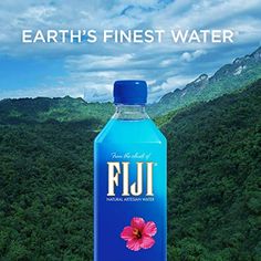 a bottle of fiji water with mountains in the background