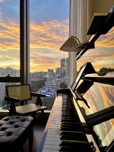 a piano sitting next to a window in a living room