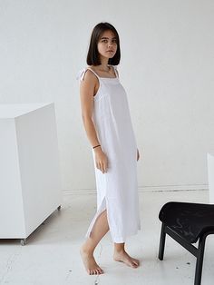 "Pure white long women's softened linen night dress with regulating straps. Choose size: XS Bust 82 - 84 cm. ( 32 1/4\" - 33\") Waist 66 - 68 cm. / (26\" - 26 3/4\") Hips 90 - 92 cm. / (35 1/2\" - 36 1/4\") S Bust 86 - 88 cm. ( 33 3/4\" - 34 3/4\") Waist 70 - 72 cm. / (27 3/4\" - 28 1/4\") Hips 94 - 96 cm. / (37\" - 37 3/4\") M Bust 90 - 92 cm. ( 35 1/2\" - 36 1/4\") Waist 74 - 76cm. / (29 1/4\" - 30\") Hips 98 - 100 cm. / (38 1/2\" - 39 1/4\") L Bust 94 - 96 cm. ( 37\" - 37 3/4\") Waist 78 - 80 White Linen Dress With Straight Neckline, White Cotton Lounge Dress, White Slip Dress With Tie Straps, White Dress For Spring Lounging, White Linen Dress With Straight Neckline For Summer, White Summer Dress For Lounging, White Linen Sleeveless Dress With Adjustable Straps, White Linen Dress With Adjustable Straps, White Sleeveless Linen Dress With Adjustable Straps