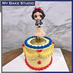 a cake that is decorated to look like snow white