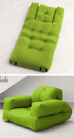 a green futon couch sitting on top of a white floor