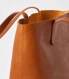 Eternally chic, polished, and versatile staples like this lush and roomy leather tote are the secret to an effortlessly flawless style routine. 14" x 16.",Imported:Imported Loft Leather Tote Bag Cognac Women's by Loft Size Regular - One Size Cognac Women's Bags, &, Clutches, Fashion, Accessories Brown Leather Bucket Bag With Rolled Handles, Brown Shoulder Bag With Rolled Handles For Work, Classic Everyday Bucket Bag With Leather Lining, Classic Bucket Bag With Rolled Handles For Travel, Workwear Bucket Bag With Leather Lining, Brown Workwear Bags With Rolled Handles, Classic Travel Bucket Bag With Rolled Handles, Classic Leather Bucket Bag With Rolled Handles, Classic Cognac Bucket Bag For Shopping