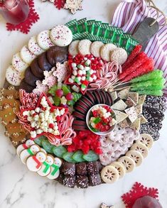 a platter filled with assorted candy and candies on top of a table