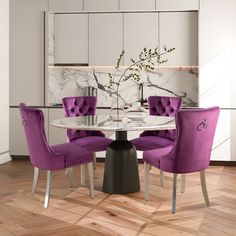 a dining room table with purple chairs and a white marble topped centerpiece in the middle