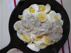 an image of eggs and gravy in a skillet