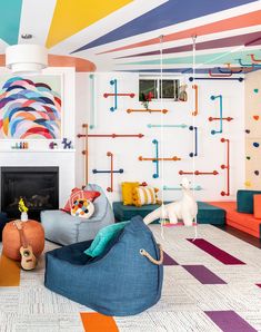 a colorful living room with lots of furniture and decor on the walls in different colors