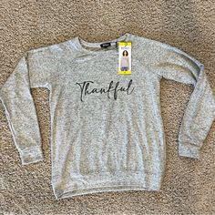 Buffalo David Bitton Thankful Cozy Crewneck Top Ultra Soft Gray Size Small Brand New Measurements In Photos Color: Heather Grey Thankful Super Soft Cozy Crewneck With Relaxed Fit & Banded Hem Ultrasoft Fabric Blend Crewneck Top Raglan Long Sleeves Banded Hem And Cuffs Relaxed Fit 76% Viscose 19% Polyester 5% Elastane Gift, Friends, Grateful From No Pet No Smoke House Cozy Gray Tops With Letter Print, Cozy Gray Top With Letter Print, Trendy Heather Grey Sweatshirt For Fall, Trendy Heather Grey Fall Sweatshirt, Gray Cozy Fit Top For Fall, Cozy Gray Letter Print Top, Cozy Fit Gray Top For Fall, Comfortable Gray Sweater For Fall, Gray Letter Print Sweatshirt For Fall