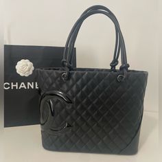 Chanel Cambon Bucket Large Tote Which Has Been Discontinued Since 2012 Is Absolutely Stunning Like Only Chanel Knows How To Do! Like Band New. W Honestly This Bag Is Priceless, You Can Not Find A Bag This Old Like Brand New, Pretty Much Impossible.. Will Be Extremely Hard To Give This Babe Up This Is A Medium To Large Size Tote And Brand New Never Used, 13.5 Inches Long Height Of Bag Is 10 Inches, (18 Inches From Top Of Strap To Bottom Of Bag And 6 Inches Deepcant Find This Bag Like Brand New Li Designer Black Bags For Office, Luxury Black Shopping Bag, Designer Black Office Bags, Designer Formal Bags With Large Capacity, Designer Large Capacity Formal Bags, Luxury Black Shoulder Bag For Shopping, Chanel Cambon, Chanel Tote, Large Tote