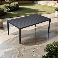 a black table sitting on top of a patio