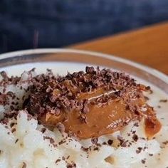 a plate topped with mashed potatoes covered in chocolate