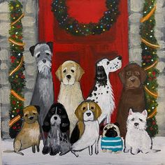 a group of dogs standing in front of a red door with wreaths on it