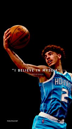 the basketball player is about to dunk the ball with his hand and has an inspirational quote on it