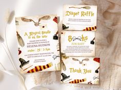 three harry potter themed baby shower items on a white background with feathers and ribbons around them