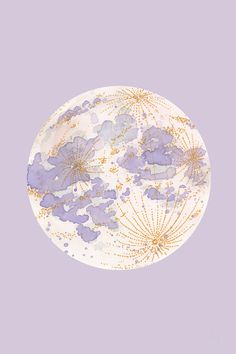 a white plate with purple and gold designs on the rim, against a light purple background