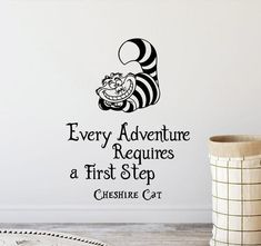 a wall decal that says every adventure requires a first step cheesy cat