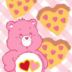 a pink teddy bear holding a plate with hearts on it