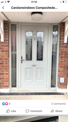 a white front door with two sidelights