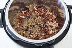 a pot filled with lots of food sitting on top of a counter