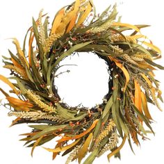 an orange and green wreath with red berries on it's end is shown against a white background