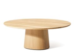 a round wooden table with no one around it