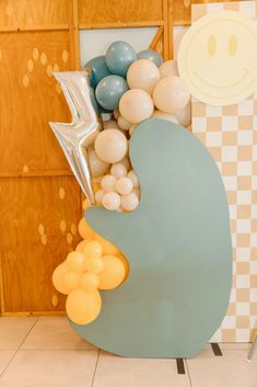 balloons in the shape of a whale on display at a children's birthday party