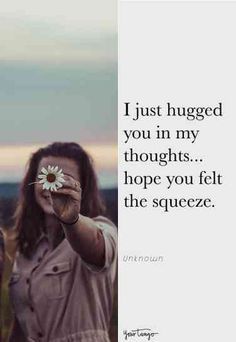 a woman holding a flower up to her face with the caption i just hugged you in my thoughts hope you felt the squeeze